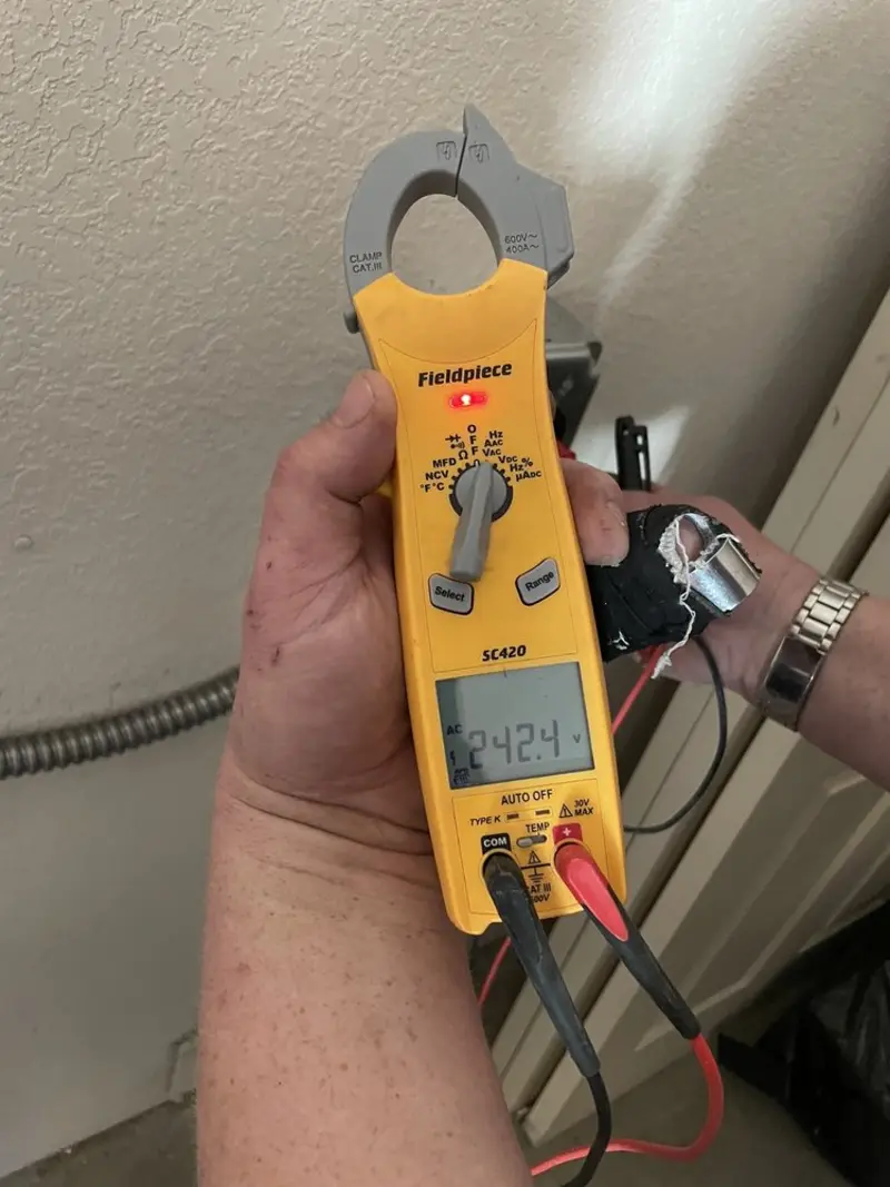 Voltage testing with clamp meter during Circuit Breaker Repair in East Bethel